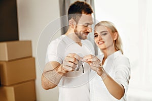 Young Family With Keys To New Home