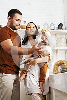 Young family with little cute son on kitchen in morning happy smiling, lifestyle people concept