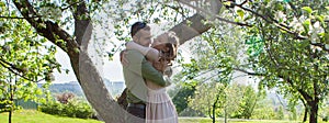 Young family, mother, father, daughter, walk in the city park