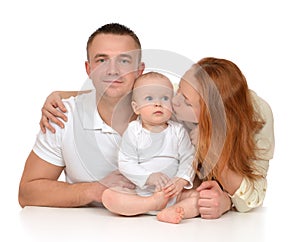 Young family mother and father with newborn child baby girl