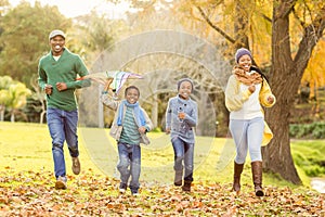 Young family playing with a kite