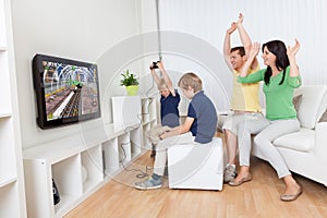 Young family playing videogames