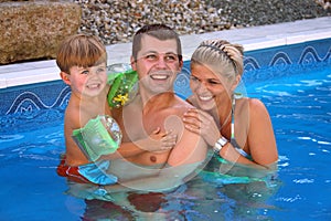 Young family in the pool