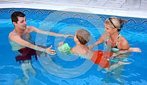 Young family in the pool