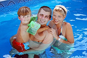 Young family in the pool