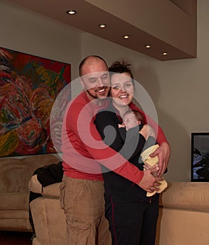 young family portrait with newborn baby