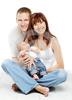 Young family portrait, smiling father mother and baby son