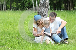 Young family reading the Bible