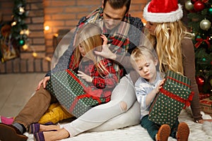 Young family on soft rug