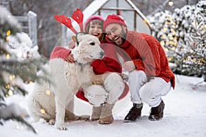 Young family spending happy winter time together outdoors