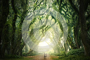 Young family standing near huge branches of trees