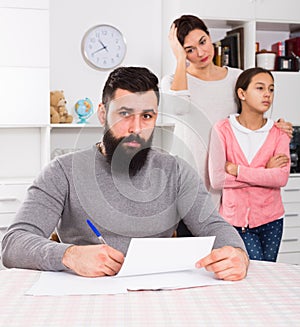 Young family struggling to pay utility bills and rent for their apartment