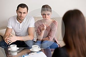 Young family talking to psychologist. Couple counselling, profes