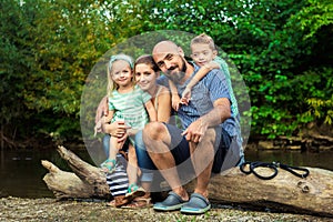 Young family with their pet dog, golden retriever