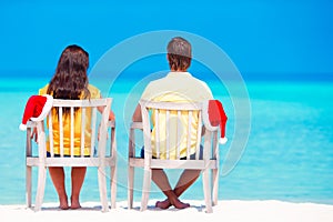 Young family on tropical beach during Christmas