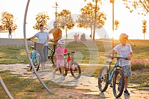 Young family with two children with bicycles