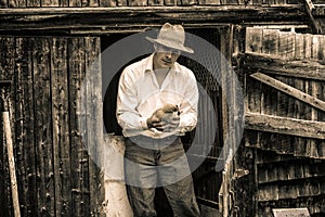 Young Farmer and a Chicken