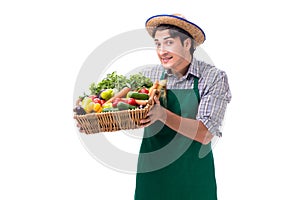 The young farmer with fresh produce isolated on white background