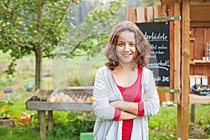 Young farmer girl at food market