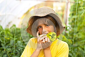 Young farmer in greenhouse