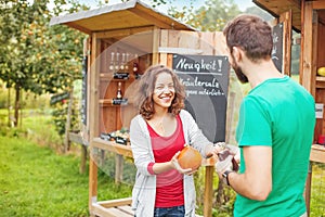 Young farmer selling vegetables