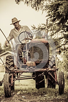 Young Farmer on a Vintage Tractor