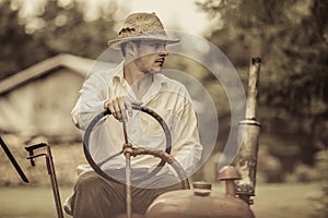 Young Farmer on a Vintage Tractor photo