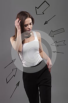 Young fashion brunette woman. Thinking seriousely, issue concept photo