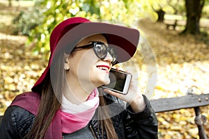 Young fashion business woman calling on mobile phone