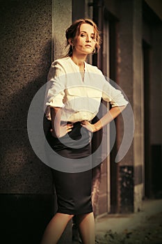 Young fashion business woman in white shirt at office building