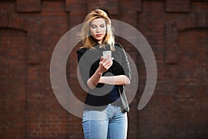 Young fashion business woman using smart phone