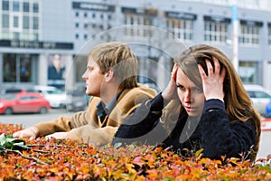 Young fashion couple in conflict on a city street