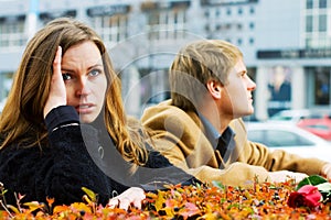 Young fashion couple in conflict on a city street