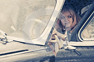 Young fashion couple driving vintage car