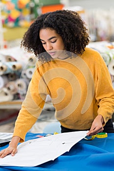 young fashion designer woman checking color palette samples