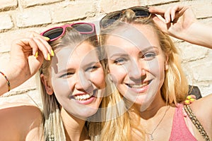 Young fashion happy women girls taking summer selfie