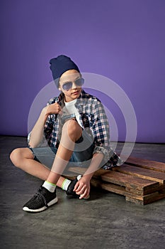 Young fashion man boy sitting on the floor.