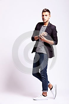 Young fashion man in a pose