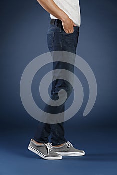 Young fashion man`s legs in jeans