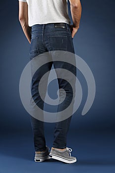 Young fashion man`s legs in jeans