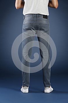 Young fashion man`s legs in jeans