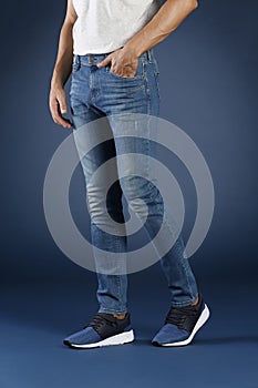 Young fashion man`s legs in jeans