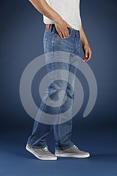 Young fashion man`s legs in jeans