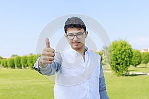 Young fashion man showing thumb up.Great like.
