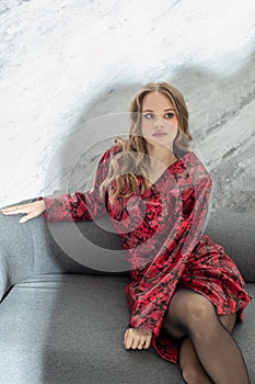 Young fashion woman in red leather coat