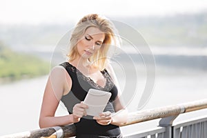 Young fashion woman using digital tablet computer