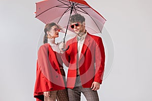 Young, fashionable couple in red blazers