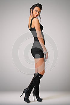 young fashionable girl in a black tight dress