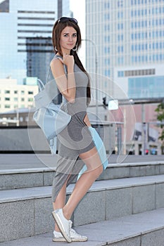 Young fashionable girl in the cityscape