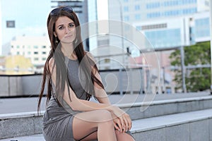 Young fashionable girl in the cityscape